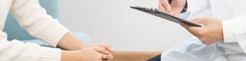 Patient receiving mental health consultation from a doctor.
